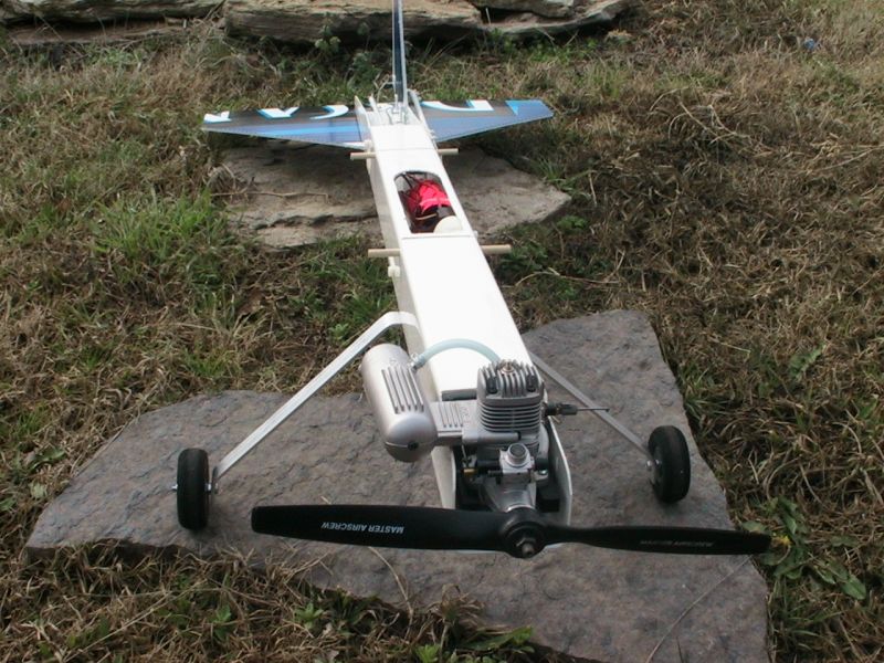  OS .46 LA engine, 11x6 prop and Hitec radio gear.  The plane weighs just under 6 pounds.