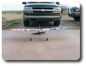 The wingspan is 60 inches. I placed the plane in front of the Chevy Tahoe for scale comparison.