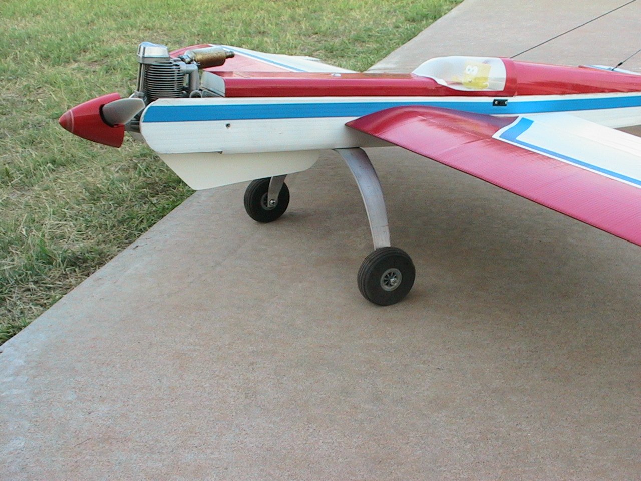  I got tired of the lower fuse extension being taped on so I cut a piece of 2.5 gutter pipe out and attached it to the bottom of the fuse with screws. Knife edge is even better now because the fuse extension is a little bigger than before. I can gain altitude when pulling on the rudder (right side of plane at top of knife edge). My control rod flexes when pushing the rudder, and the knife edge on that side is not as good. My CG is 3.75 inches from the LE using the hanging by loops and plumb-bob technique. Probably could go to 4 inches now that I am used to it. 